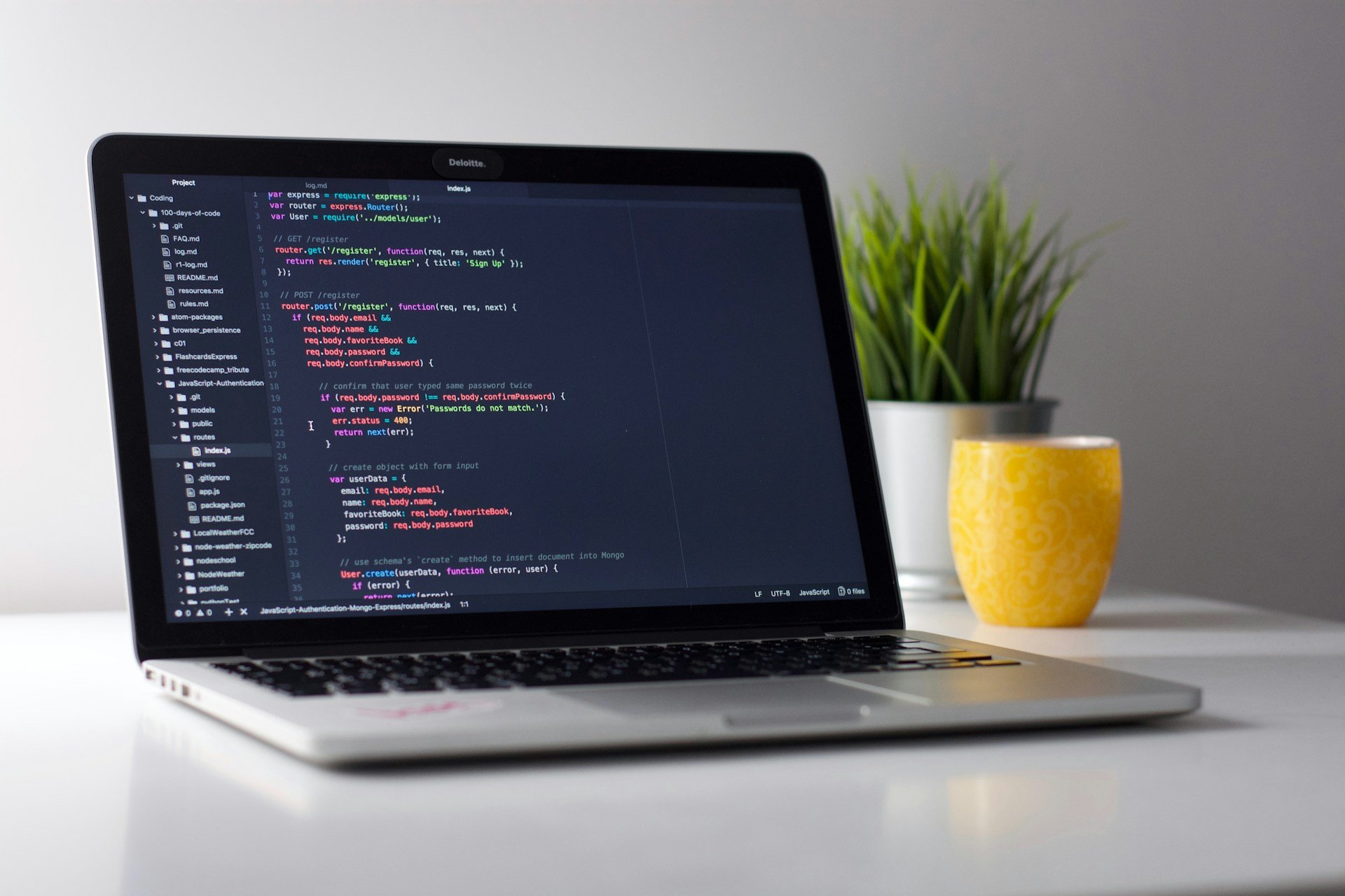 Developer workstation with code on monitors